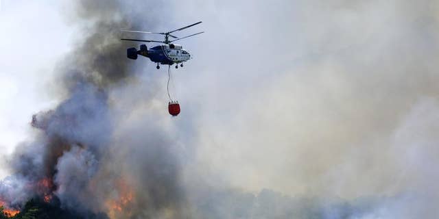 Waldbrände brennen, während Teile Spaniens mit einer Rekordhitzewelle zu kämpfen haben. 